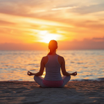 Woman practicing meditation on the beach at sunset, sitting cross-legged in peace and mindfulness.